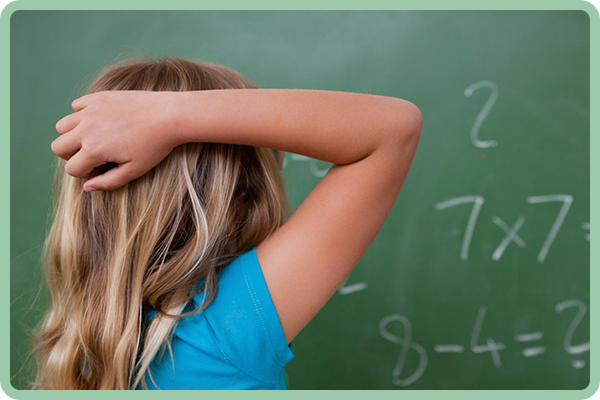 Girl is doing math on the board