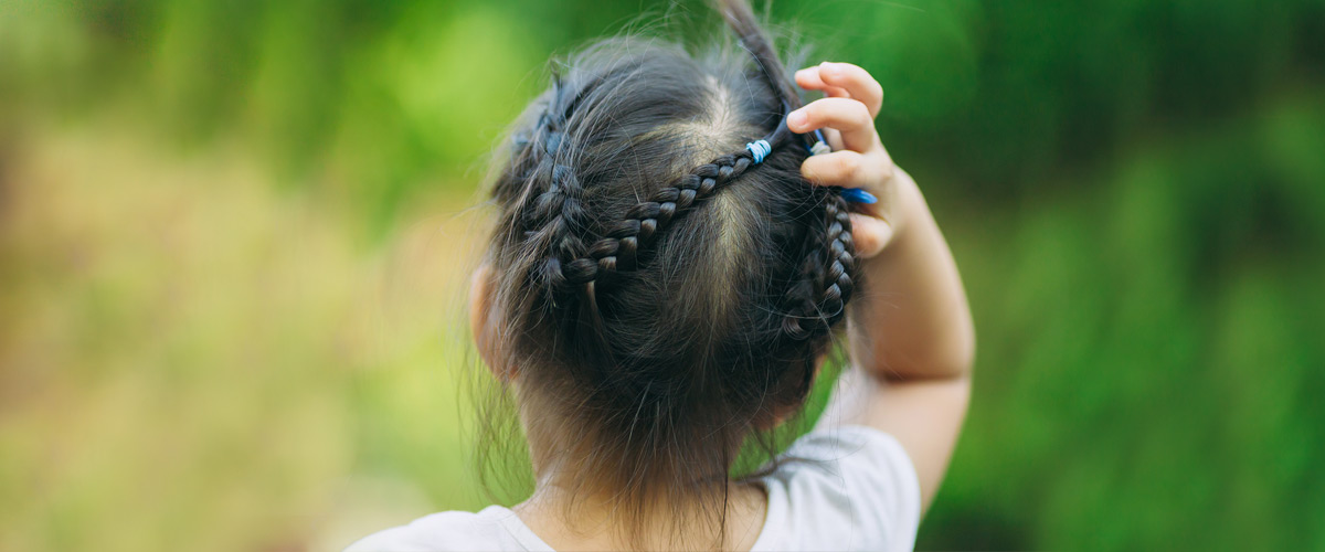 A girl touching her hair